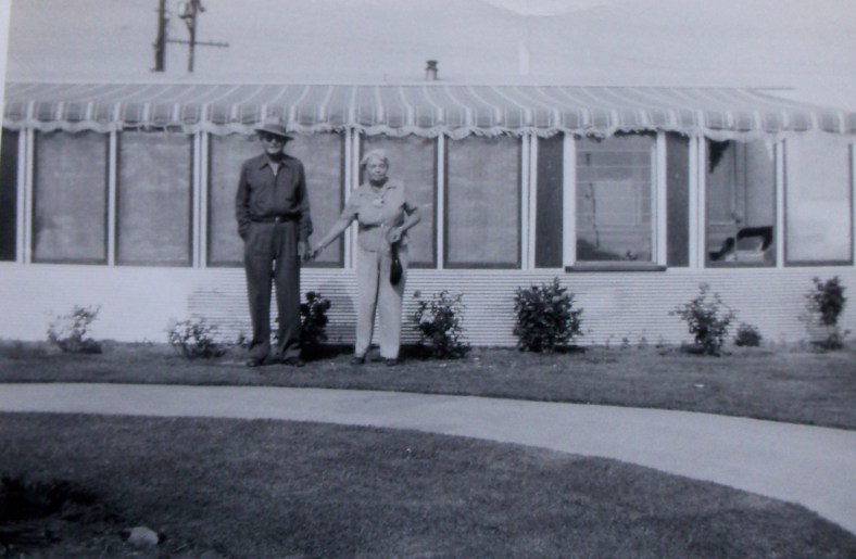 Matt & Bea in front of their trailer